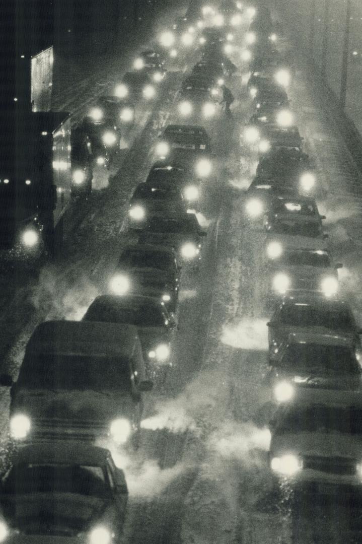 At a standstill: Rush-hour traffic on the Gardiner Expressway was slower than usual as the storm turned the highway into a virtual parking lot and even short trips stretched into hours