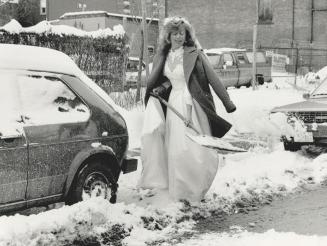 Where's my bridesmaid? Alison Tidey, digging out her car on Berkley St