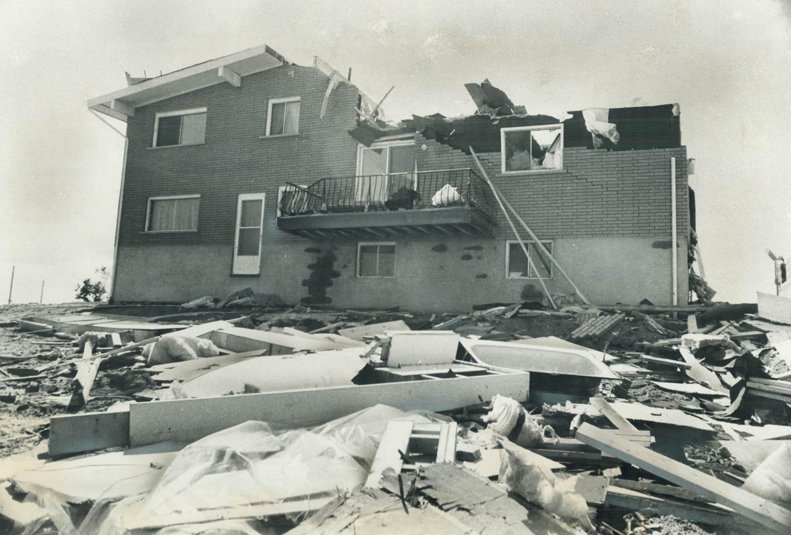 Smashed by the storm this Sudbury house had most of its roof ripped away by 100-mile-an-hour winds that swept through Nickel Belt area yesterday leavi(...)