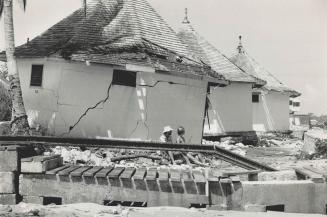 Path of destruction: A light plane (top) is bowled over at Jamaica's Kingston Airport, sailboats are swamped and grounded at Montego Bay, and vacation cabins at Runaway Bay are ripped apart