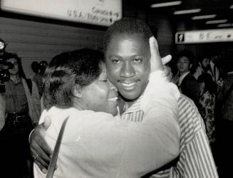 Safe ground: Jamaica native Horace Atkins is reunited with his sister, Lola Stewart, at Pearson airport last night