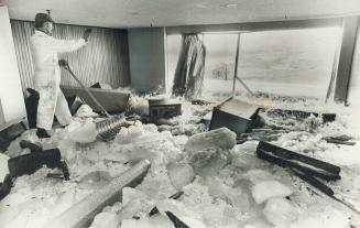 Waves drive huge cakes of ice into one of lounges at Boulevard Club on Lake Shore Blvd