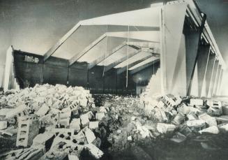 The windsor curling rink in which eight persons were killed and eleven injured had the roof ripped off and a wall demolished by a freak tornado. Concr(...)