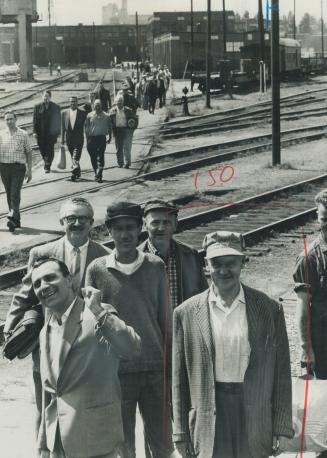 Last shift. Striking railway workers walk off their jobs at the CPR John St. yards on their way to the picket line as the strike spread rapidly across(...)