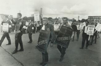 Clerks' view of rail dispute. Censored placards showed their opinion of Parliament