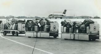Forlorn looking luggage lies at Toronto International Airport, closed for the third day by the strike of air traffic controllers. Today, as Parliament(...)