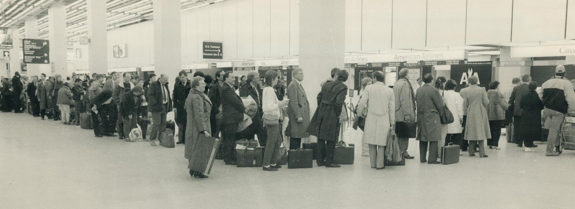 Anxious travellers crowd ticket counters today in Terminal 1 at Pearson International Airport