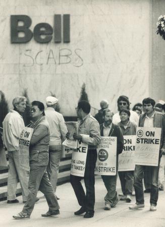 Technicians picket the front entrance of the Bell Canada building on Adelaide St