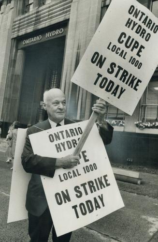 Ontario hydro employee George Cole pickets the company's head office at 620 University Ave