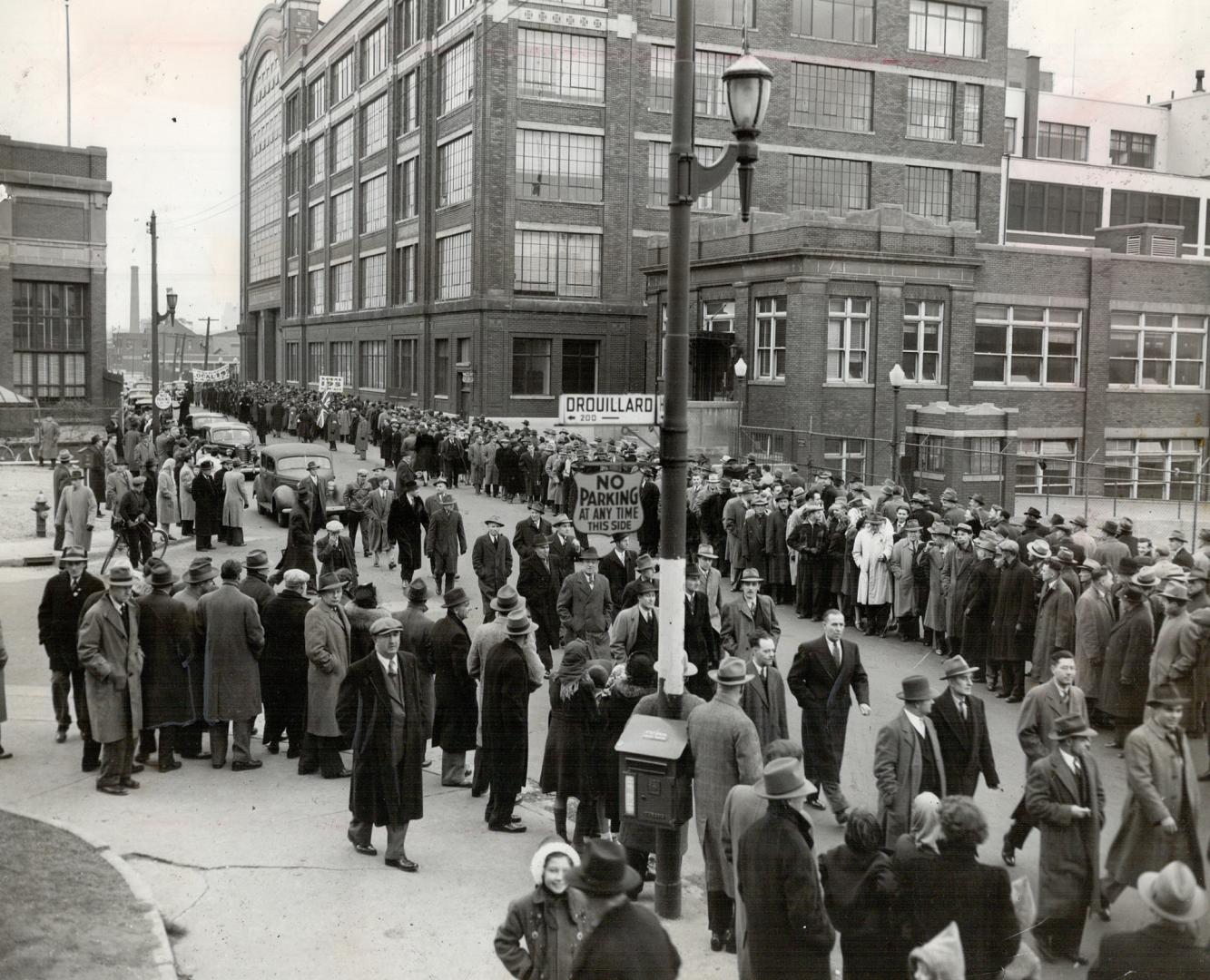 Ranks Swollen by sympathetic workers from 28 Windsor area plants, 8,000 pickets marched in front of the two main gates of the Ford plant today. An are(...)