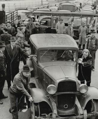 Owner of a private car, after presenting proper identification, was assisted out of the thickest of the barricade in front of the Ford plant's main gate by good-natured pickets