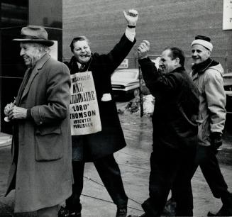 At right is shown the joyful reaction of pickets outside the newspaper office as word reached Oshawa