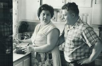 Helen Ainsworth packs lunch for her husband, Carl