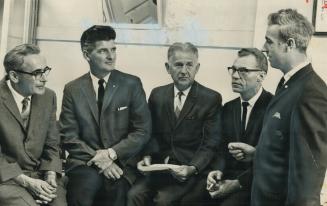 Four convicted pickets talk with textile workers official george watson