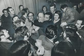 Jubilant strikers mob Archie Wilson (being hugged, centre) after Douglas Aircraft production workers today turned down second chance to vote on compan(...)