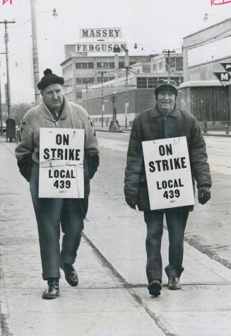 Pickets start marching at Massey, Robert Miller (left), with 24 years' service in the stores department, and Norbert Moreau, 30 years in the shipping (...)