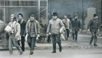 Leaving the factory, workers at Massey-Ferguson plant on King St