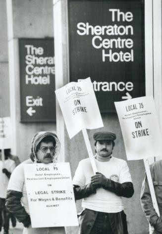 Walking the line: Striking workers picket the Sheraton Centre today, joining 3,000 others across Metro, after contract negotiations broke down