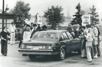 Pickets at York University, above, stop car during recent strike