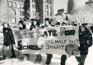Opposing the nine-week-old strike of secondary school teachers, students march and chant at Queen's Park yesterday