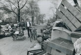 The walk through Allan Gardens gets narrower and narrower as the piles of garbage and trash grow steadily higher and wider. Douglas Evans, 7, must wal(...)