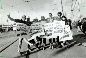 Waiting Line: TTC strikers in their sixth day off the job keep up their spirits at the Connaught yard yesterday as they wait for word of a new agreement worked out in an overnight mediation session
