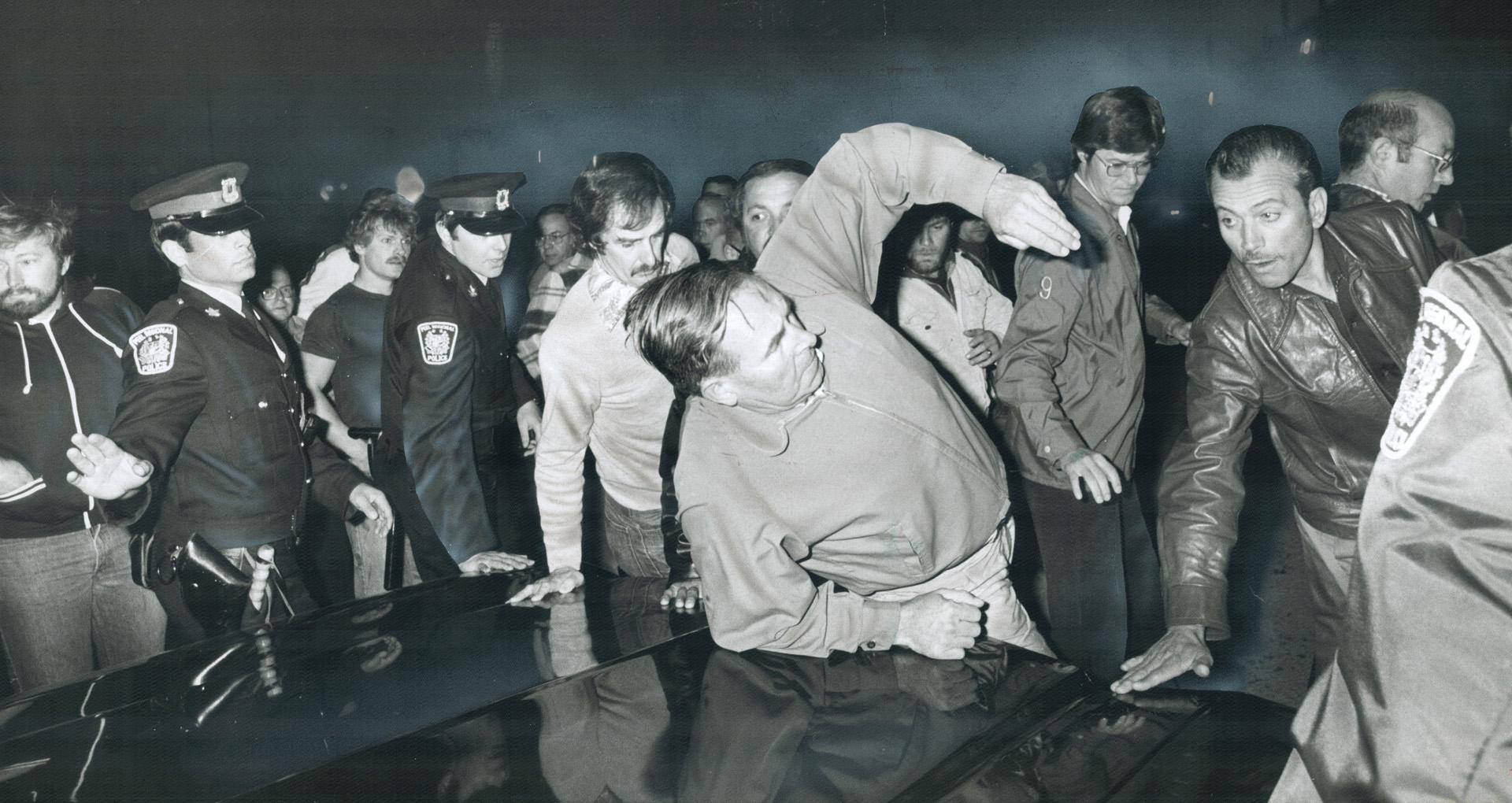 Hold that line, Pickets at the strike-bound plant of Butcher Engineering Enterprises of Brampton attempt to hold back a car trying to cross the line t(...)