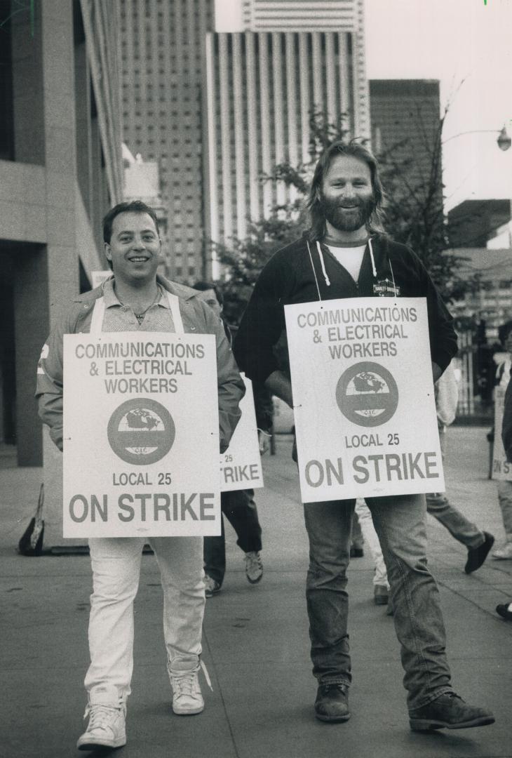 Striking bell: Off the job for the first time in eight years, Bell Canada operators and technicians set up picket lines today at the company's head office on Trinity Square