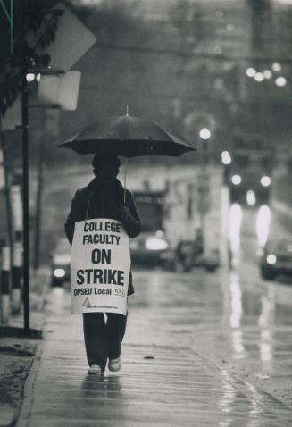 Rainy day picket, A lone picket walks the line outside the Casa Loma campus of George Brown College yesterday