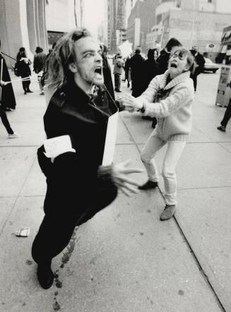 Protest with style: George Brown College theatre-arts students stage a public performance at Bloor and Yonge today to dramatize their side of the teachers' strike