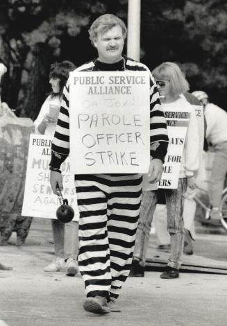 Strike stripes, Federal parole officer Colin Campbell's costume shows how he feels as he and his fellow officers picket yesterday in front of Sunnybrook Medical Centre