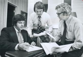 Negotiating new contracts for teachers in elementary and secondary separate schools in seven scattered districts of Ontario, Leo Normandeau (left), th(...)