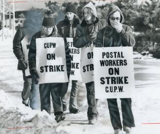Below-zero weather made life miserable for striking postal workers on the picket line at the Eastern Ave