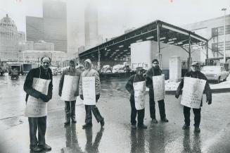 Striking members of the Public Service Alliance of Canada picket outside the main Post Office building on Lakeshore Blvd. A strike by members of essen(...)