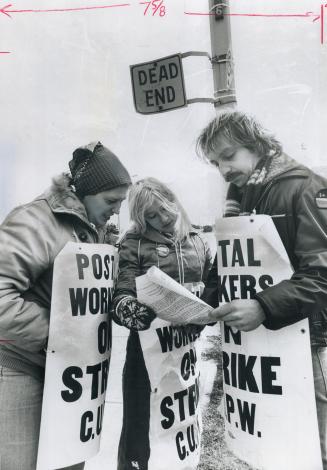 Signs of worrying times: Picketing postal workers and a roadside omen