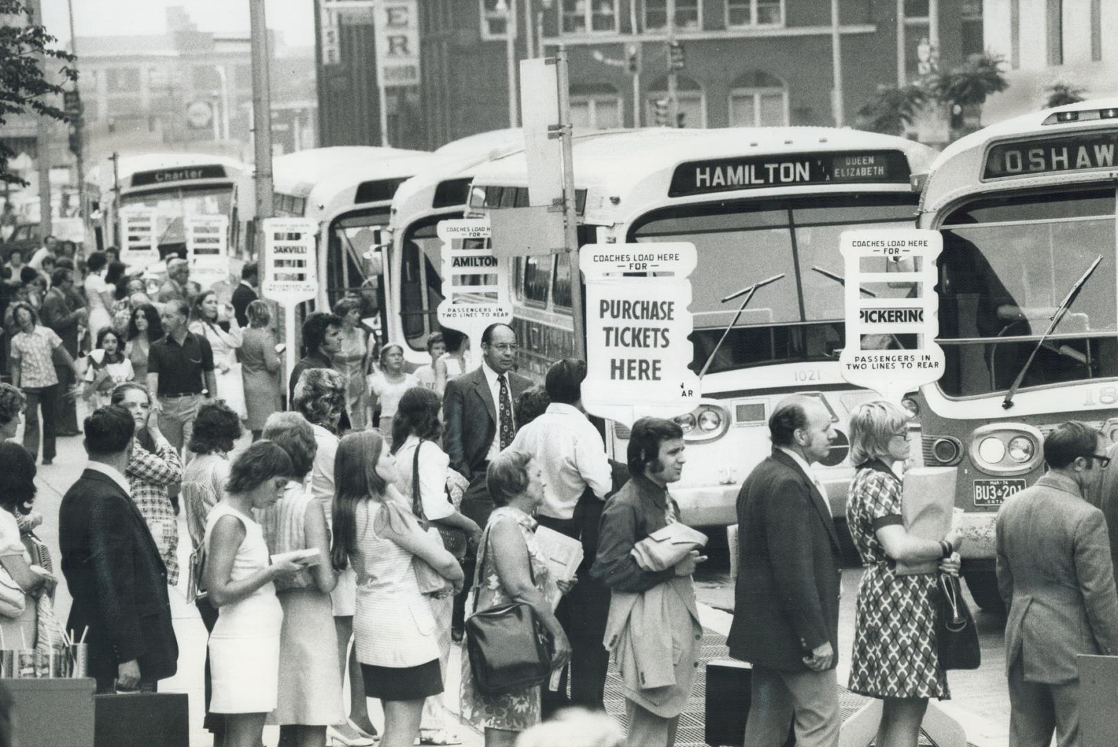 Commuters lined up outside Union Station yesterday for buses to take them home