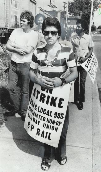 Union members walk a picket line during the last railway strike, in 1973, when they were legislated back to work after 10 days. The chief union negoti(...)