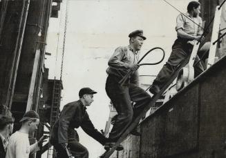April 21, 1948, saw this boarding party clumbing to the deck of packet freighter Superior at Windsor