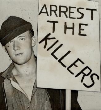 Many Signs like this being carried by a striking seaman protested shotgun shooting of five C