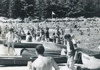 Despite Reports that Algonquin's Lake of Two Rivers was polluted, thousands of campers crowded its beach over the holiday weekend. Hundreds had to be (...)