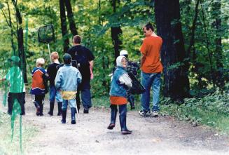 Camp Oasis Frog catching Detail with Jesse Burgie, 10 (Glasses) Looking over his Shoulder