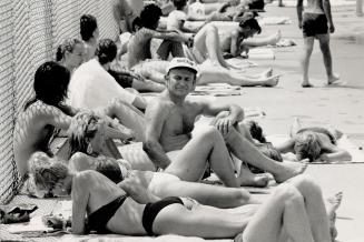 Heat wave: Sunbathers enjoy the rewards of summer at Sunnyside pool yesterday