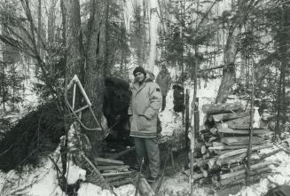 This is home?, Students Rudy Vandrie (foreground), Lee Norris outside their lean-to in the bush