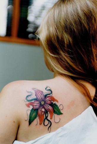 Flower power: Mardi Watson's tattoo is by artist Toby Martin