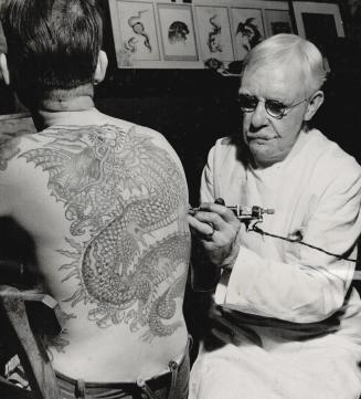 This Tattoo Artist is Burchett of London, England, and, strange to say, the back on which his chef d'oeuvre, a Chinese dragon, is displayed belongs no(...)