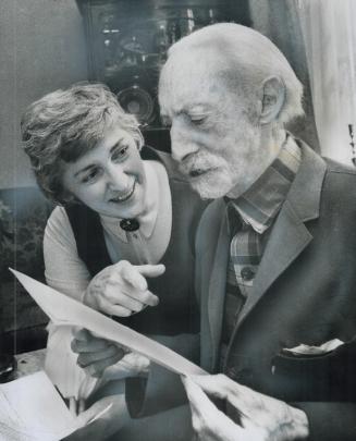 Explaining the tax form, Ruby McCannell helps George A