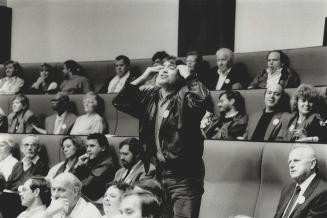Revolted taxpayer: An outraged man shows Metro councillors last night how he feels about the market value assessment plan