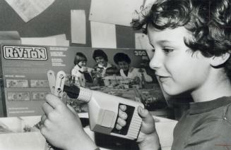 Dangerous Toy, Matthew Vienneau holds a Riviton construction set toy which is being pulled from store shelves across Canada by its manufacturer