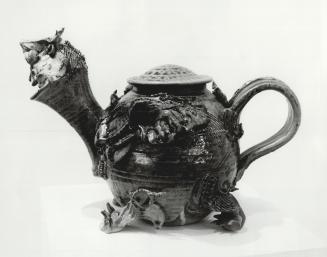 Portrait of Frank: That is the name given this fanciful teapot at the Craft Gallery by creator Wayne Cardinalli of Sterling