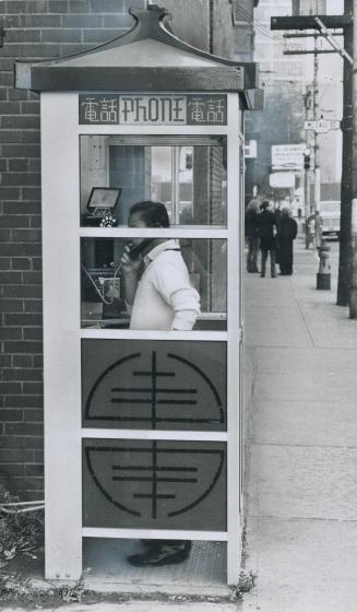 It has an oriental ring, A public telephone booth on Dundas St